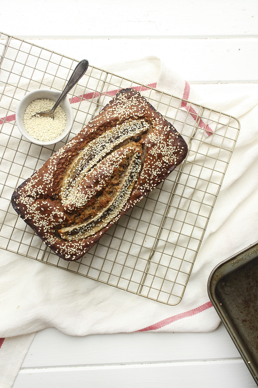 Tahini, Pecan, Chocolate Banana Bread - Make this banana bread recipe if you wish to up your banana bread game! Adding tahini, dark chocolate and pecans adds so much more flavour and crunch #bananabread #banana #tahini #baking #snack #quickbread #ripebananas